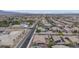 This aerial shows a desirable neighborhood, putting green and close access to the main thoroughfare at 6985 Hopi Summit Ct, Las Vegas, NV 89149