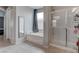 Well-lit bathroom featuring a walk-in shower, soaking tub, and neutral finishes at 6985 Hopi Summit Ct, Las Vegas, NV 89149