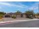 Inviting single-story home featuring a three-car garage and a well-manicured front yard at 6985 Hopi Summit Ct, Las Vegas, NV 89149