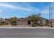 Charming single-story home with a well-maintained front yard and a two-car garage at 6985 Hopi Summit Ct, Las Vegas, NV 89149