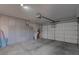 Spacious garage with lots of room and storage shelves, and epoxy floor at 6985 Hopi Summit Ct, Las Vegas, NV 89149