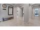 Beautiful hallway with neutral paint, tile flooring and archways at 6985 Hopi Summit Ct, Las Vegas, NV 89149