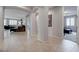 Inviting hallway with tile floors, archways, and a glimpse of the living spaces at 6985 Hopi Summit Ct, Las Vegas, NV 89149