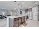 Beautiful kitchen island featuring gray cabinets and stainless steel appliances at 6985 Hopi Summit Ct, Las Vegas, NV 89149