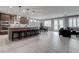Open-concept kitchen featuring a large island with seating and stainless steel appliances at 6985 Hopi Summit Ct, Las Vegas, NV 89149