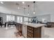 Spacious kitchen island with granite countertops and stainless steel appliances in an open floor plan at 6985 Hopi Summit Ct, Las Vegas, NV 89149