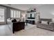 Modern living room featuring a comfortable leather sofa and stylish decor at 6985 Hopi Summit Ct, Las Vegas, NV 89149