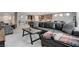 Open-concept living space with view of modern kitchen and comfortable seating arrangement at 6985 Hopi Summit Ct, Las Vegas, NV 89149