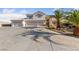 Expansive home boasts a generous six-car garage and meticulously maintained desert landscaping at 6999 Stone Meadows Ave, Las Vegas, NV 89142