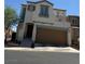 Inviting two-story home with a private balcony, and a convenient two-car garage at 7484 Butterton Ct, Las Vegas, NV 89139