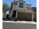 Inviting two-story home with a private balcony, and a convenient two-car garage at 7484 Butterton Ct, Las Vegas, NV 89139