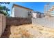 Property backyard featuring block wall and minimal, desert landscaping under a bright blue sky at 7553 Durham Hall Ave # 201, Las Vegas, NV 89130