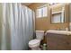 Updated bathroom features light wood vanity, shower with curtain, and standard toilet at 7553 Durham Hall Ave # 201, Las Vegas, NV 89130