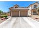 A charming two-story home featuring a spacious two-car garage with a concrete driveway at 7553 Durham Hall Ave # 201, Las Vegas, NV 89130