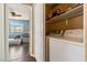 Easy laundry setup with washer, dryer, and shelving at 7553 Durham Hall Ave # 201, Las Vegas, NV 89130