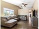 Spacious living room with a large window for natural light, comfortable seating, and vaulted ceilings at 7553 Durham Hall Ave # 201, Las Vegas, NV 89130