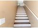 Bright stairway with a white banister and painted white and brown treads at 7553 Durham Hall Ave # 201, Las Vegas, NV 89130