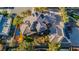 Expansive residence featuring solar panels, a stunning pool, inviting outdoor seating, and lush landscaping, captured from above at 7625 Coley Ave, Las Vegas, NV 89117