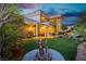 Entertain guests outdoors in the lush backyard with a fountain and access to indoor/outdoor living at 7625 Coley Ave, Las Vegas, NV 89117