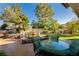 Entertain in style with a outdoor bar, grill, table and fountain in a cozy backyard at 7625 Coley Ave, Las Vegas, NV 89117