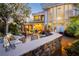 This backyard includes a built in BBQ area, in ground pool, and access to the house through large glass walls at 7625 Coley Ave, Las Vegas, NV 89117