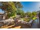 An inviting backyard featuring lush landscaping, a tiered fountain, and comfortable seating at 7625 Coley Ave, Las Vegas, NV 89117
