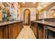 Wet bar with custom cabinets, granite counters and plenty of space for entertaining at 7625 Coley Ave, Las Vegas, NV 89117