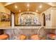 Home bar featuring custom glass rack, ample counter space, and seating for four at 7625 Coley Ave, Las Vegas, NV 89117