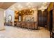 An entertainment bar with seating, custom cabinets and arched doorways at 7625 Coley Ave, Las Vegas, NV 89117