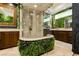 Gorgeous primary bathroom with glass enclosed shower and double vanities at 7625 Coley Ave, Las Vegas, NV 89117