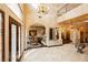 Elegant entry featuring high ceilings, custom iron doors, and archways offering a glimpse into the beautiful and inviting spaces at 7625 Coley Ave, Las Vegas, NV 89117