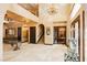 Grand foyer featuring soaring ceilings, chandelier, staircase, and travertine flooring at 7625 Coley Ave, Las Vegas, NV 89117