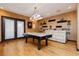 Spacious game room boasts an air hockey table and comfortable seating for entertainment at 7625 Coley Ave, Las Vegas, NV 89117