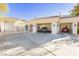 Spacious multi-car garage with ample parking space and stylish exterior lighting at 7625 Coley Ave, Las Vegas, NV 89117