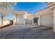 Well-lit garage space with multiple bays and sleek, modern doors at 7625 Coley Ave, Las Vegas, NV 89117