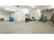 A spacious garage includes exercise equipment with dual car access and ample room for multiple uses at 7625 Coley Ave, Las Vegas, NV 89117