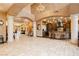 Bright open floor plan featuring tile floors, arched columns and a kitchen with granite counters and stainless appliances at 7625 Coley Ave, Las Vegas, NV 89117