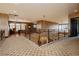 Open hallway with elegant railing overlooking the game room and stylish flooring at 7625 Coley Ave, Las Vegas, NV 89117