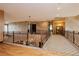 Spacious hallway features decorative wrought iron railing and warm, neutral tones at 7625 Coley Ave, Las Vegas, NV 89117