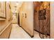 Long hallway with art niches and ironwork detail at 7625 Coley Ave, Las Vegas, NV 89117