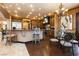 A gourmet kitchen featuring a large center island, custom cabinets, stone counters, and stainless appliances at 7625 Coley Ave, Las Vegas, NV 89117