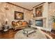 Sophisticated living room with ornate fireplace, hardwood floors, and decorative furniture creating a classic ambiance at 7625 Coley Ave, Las Vegas, NV 89117