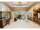 Spacious living area featuring columns, a fireplace, and a bar, creating an ideal space for entertaining at 7625 Coley Ave, Las Vegas, NV 89117