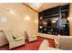 Cozy media room with plush seating, built-in shelving, and a large screen for ultimate entertainment at 7625 Coley Ave, Las Vegas, NV 89117
