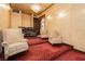 Comfortable media room with tiered seating, creating an immersive home theater experience at 7625 Coley Ave, Las Vegas, NV 89117
