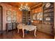 Elegant office space with custom cabinets, chandelier, and hardwood floors at 7625 Coley Ave, Las Vegas, NV 89117