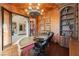 Upscale office with custom cabinetry, decorative desk, hardwood floors, and stylish design at 7625 Coley Ave, Las Vegas, NV 89117