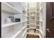Walk-in pantry with custom white shelving provides ample storage space at 7625 Coley Ave, Las Vegas, NV 89117