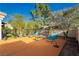 Spacious patio area with comfortable chaise lounges, ideal for outdoor enjoyment at 7625 Coley Ave, Las Vegas, NV 89117