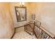 Elegant staircase with decorative railing, carpeted steps, and ornate mirror at 7625 Coley Ave, Las Vegas, NV 89117